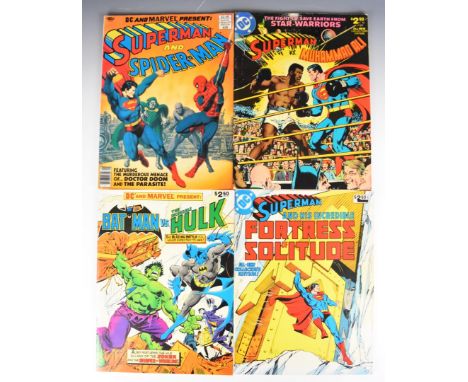 Four Marvel and DC Treasury Edition size comic books comprising Superman vs Muhammad Ali, Superman and Spider-Man, Superman a