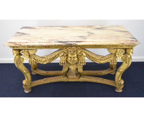 William Kent or similar gilt George II centre table, the variegated marble top having moulded edge, the gilt carved wood base