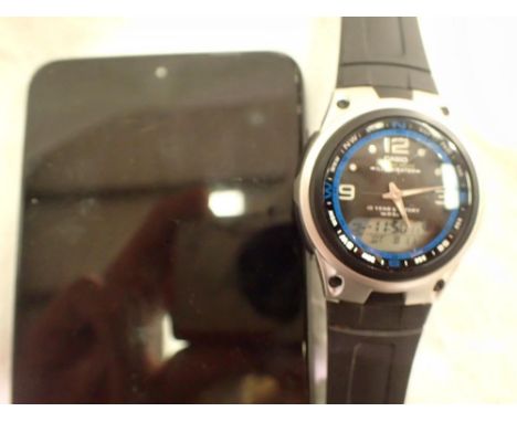 Casio digital watch and Motorola mobile phone, both working at lotting. Not available for in-house P&amp;P
