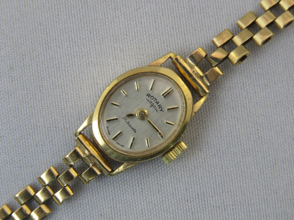 An oval ladies 9ct gold Rotary watch on a 9ct gold bracelet. Total