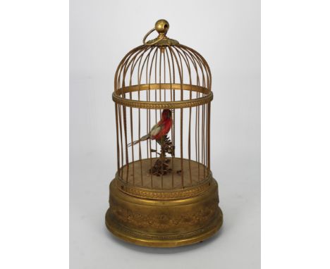 Antique Brass French Bird Cage/Music Box. Was in working condition when received. Bird articulates and sings along with music