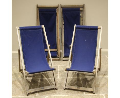 Four beech wood deck chairs, by 'Southsea deck chairs', mid to late 20th century, each of typical folding form with canvas sl