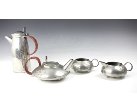 A mid 20th century Liberty ‘Heritage’ pewter four piece tea service, after Archibold Knox, comprising teapot, hot water jug, 