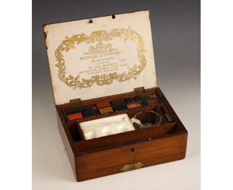 A Windsor & Newton artist's watercolour paint box, late 19th or early 20th century, with labelled paint block tray, ceramic m