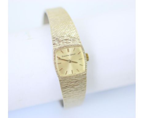 A Bueche Girod ladies white gold wristwatch, the cushion shaped dial with baton markers, set to textured case and conforming 