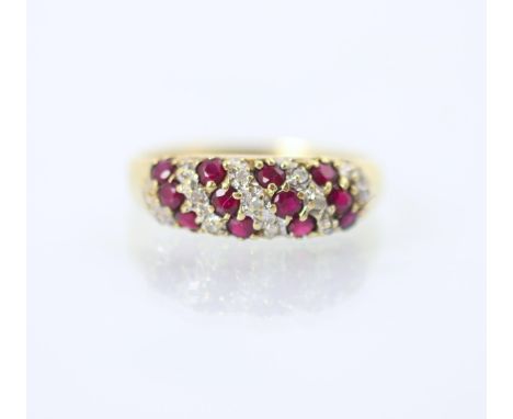 A 9ct yellow gold diamond and ruby dress ring, the nine stripes of round cut diamonds and rubies set within bombe style head 