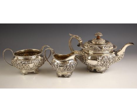 A George III silver three piece tea service, George Hunter II, London 1822, comprising tea pot, sugar bowl and milk jug, the 