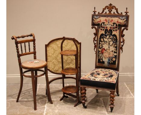 A 19th century bentwood high stool, the turned spindle backrest over a circular needlepoint seat, upon outswept legs united b