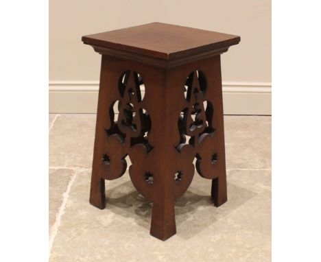 An Arts and Crafts mahogany plant stand, early 20th century, the square top upon four sides each carved with openwork stylise