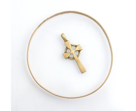 A yellow metal bangle, the plain polished bangle stamped to interior '9ct' inner width 7cm, with a 9ct rose gold 'Celtic Cros