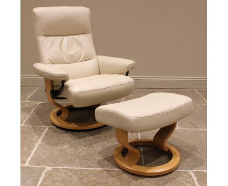 An Ekornes Stressless cream leather armchair, late 20th/early 21st century, with a reclining and swivel mechanism upon a beec
