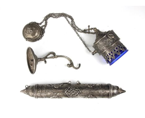 A silver coloured scroll holder, of cylindrical form with shaped terminals, the body embossed with stylised flora and bands o