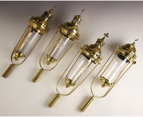 Four brass ecclesiastical processional swinging lantern heads, 20th century, each with similar pierced fleur de lys gallery, 
