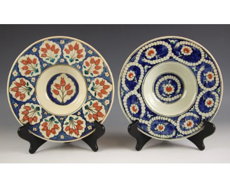 Meliha Coskun (contemporary Turkish), two studio pottery broad rimmed bowls, each decorated in an Iznik style inspired by ear