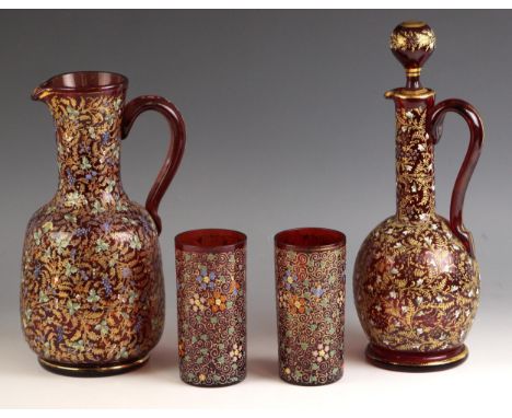 A Bohemian style cranberry glass decanter and stopper,20th century, the body decorated with gilt, white and green foliate dec