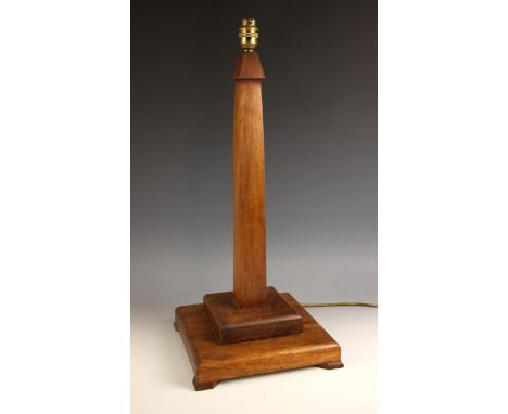 An Art Deco mahogany column table lamp, early to mid 20th century, the tapering square section column upon an integral steppe