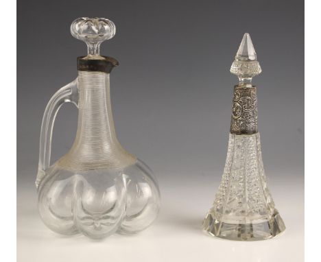 A Victorian silver mounted decanter, Hukin & Heath, Birmingham 1896, of lobed form, the neck with ribbed detail, conforming s