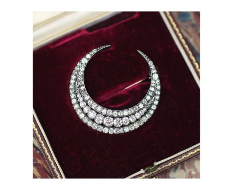 A 19th century diamond crescent brooch, possibly by Wartski, the triple crescent brooch set with graduated old cut diamonds w