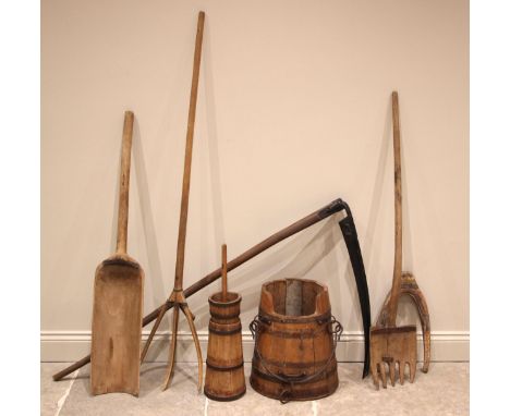 A selection of wooden agricultural implements, 19th century and later, to include a pitchfork, 164cm long, a grain scoop, 123