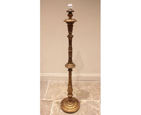 A French giltwood standard lamp, early to mid 20th century, the acanthus moulded and fluted column extending to the lobed cir