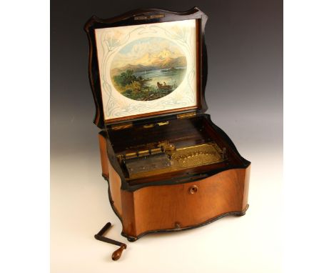 An A. Wilson Peck & Co Ltd Polyphon, late 19th/early 20th century, the key wound movement set to a serpentine walnut and burr