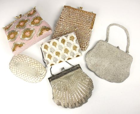 A 1950s silver bugle and seed beaded evening bag, with silver coloured metal frame, and a pink evening bag, with seed beads t