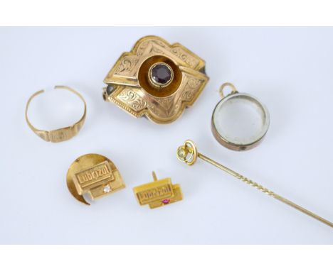 A selection of jewellery, including a 19th century style gold coloured brooch, the stylised lozenge shaped brooch with red st