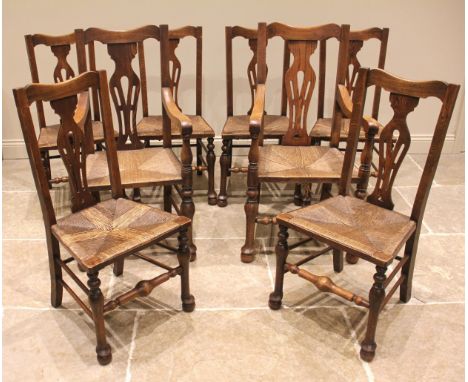 A set of eight ash splat back country chairs, late 19th/early 20th century, each with a pierced vase shaped splat over an env