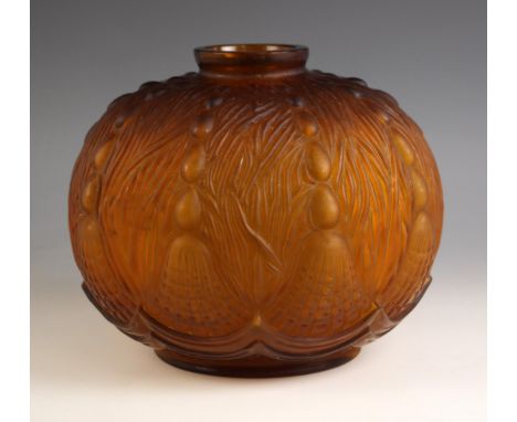 An Art Deco moulded amber glass vase by Oreor, early 20th century, of compressed globe form, the exterior moulded with stylis