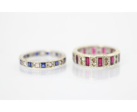 A paste and blue stone set full eternity ring, the calibre cut blue stones interspersed with paste set stones, stamped to out