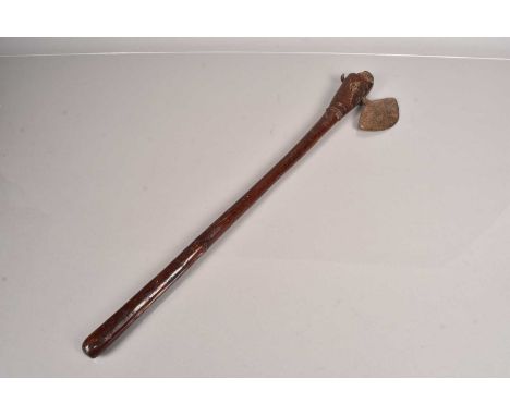 An African War Axe, possibly from Botswana, having a 'oval' shaped head (11cm diameter), on elongated attachment with ribbed 