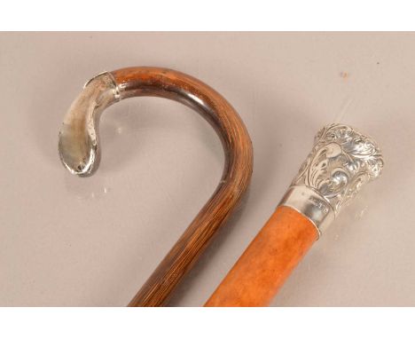 A silver topped Malacca walking cane, dated Birmingham 1977, by Dalman & Narborough Ltd, with swag design and initials to top