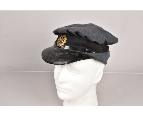 A WWII Women's Royal Air Force O/R Cap, blue woollen, with soft crown, with silk liner and waxed crown, badge to the front wi