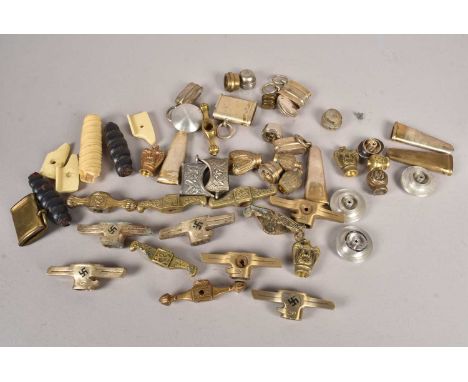 A collection of German Dagger/Knife furniture and accessories, including crossguards, pommels, scabbard top mounts, and more 