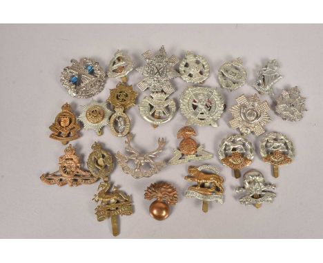 A collection of Military Cap badges, to include the Tank Corps, 17th (Duke of Cambridge's Own) Lancers, Hampshire Regiment, R