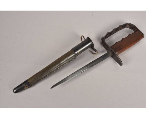 A WWI US 1917 LF&C dagger, with 20cm long triform, tapering blade, marked to the hand guard, complete with scabbard