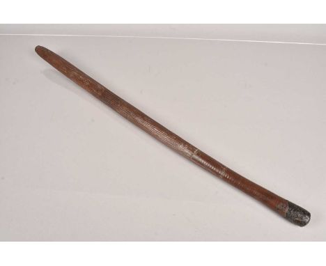 An Aboriginal Club, with incised line design to majority, with smooth grip, with applied natural 'gum' to the terminal, 70cm