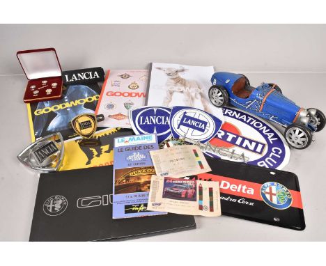 A collection of various automotive items, to include Lancia badges and enamel signs, an Alfa Romeo badge, Alfa Romeo pin badg
