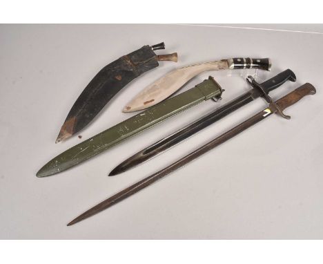 A US Bayonet and scabbard, together with another bayonet and a Middle Eastern Kukri (parcel)