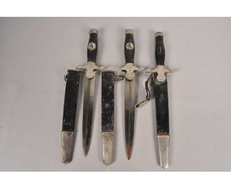 Three German RLB daggers, two stamped with makers mark, Horster of Solingen, one stuck in scabbard, (parcel), possibly reprod