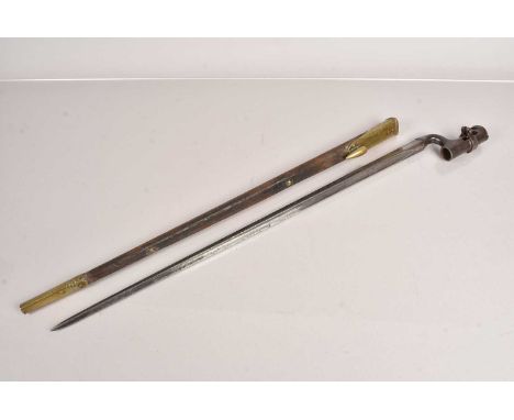 An 1876 Martini Henry Socket bayonet, marked with a Broad Arrow and War Department, also 5/88, complete with stamped brass an