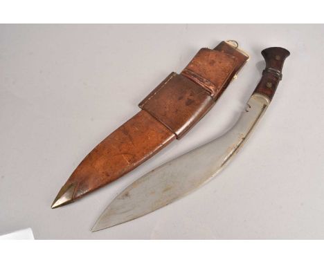 A Military Issue Kukri knife, dated 1938, and stamped with broad arrow, together with original scabbard frog (3)