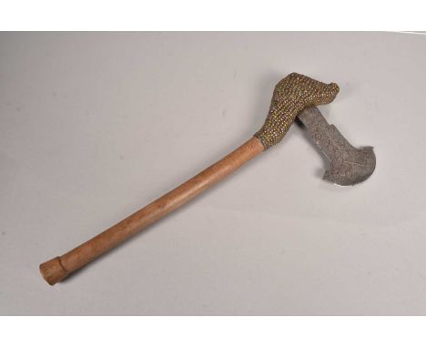 An African Axe, having beaded decoration to the top of the shaft, possibly a Club, having a decorative axe head attached, wit