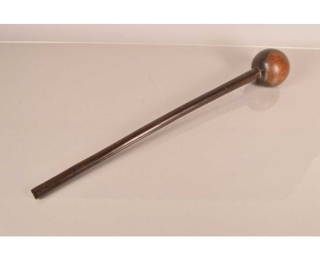 An African Hardwood Knobkerrie, having 56cmcm long shaft, with bulbous end, 9cm in diameter