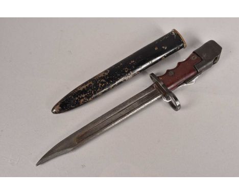A No.7 MkI Bayonet and scabbard, having 'M47B' stamped to the pommel, shaped grip and 20cm long blade
