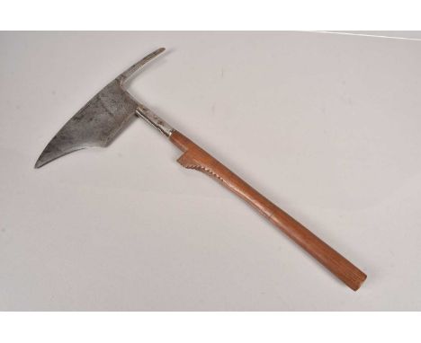 An Igorot Head-Hunting Axe, having shaped flat blade to the front, with protruding spike to the back, on shaped shaft