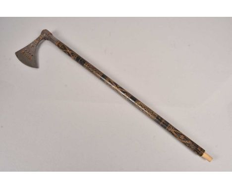 A Persian Style Battle Axe, having pierced design to the axe head, with copper decoration, on engraved shaft, possible later 