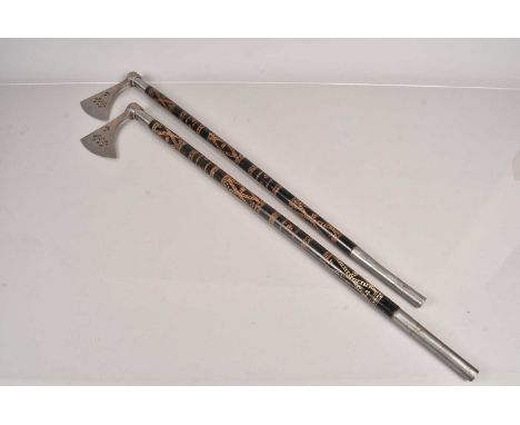 A pair of Indo Persian Battle Axes, both having concealed spears to the bottom, with pierced design to the axe head, with cop