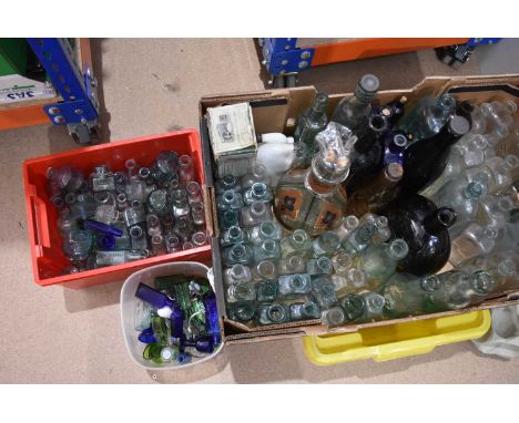 A large assortment of glass bottles, various ages, designs and sizes, from numerous manufacturers, including a four compartme