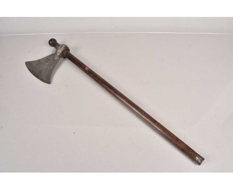 A Persian or Indian Tabar Axe, having single edged blade, with engraved design to the neck, attached to a later 68cm long sha
